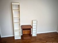 tall white shelf, brown end table, narrow white shelf full view