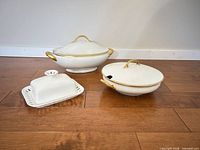 All three porcelain pieces grouped on floor