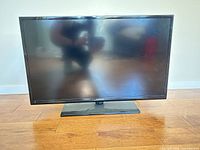 Front view of Samsung 32-inch TV on stand