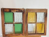 Front view of both stained glass panels showing layout, colours and frames