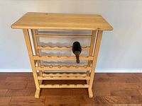 Front view of solid oak wine rack showing top and bottle tiers