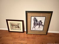 Both framed prints side by side on floor