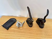 All three seal presses and pouch on tabletop