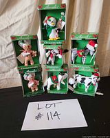 Stacked view of six boxed Annalee animal ornaments showing packaging and condition