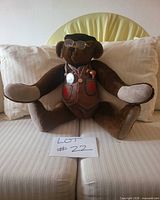 Front view seated bear with accessories visible