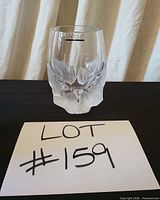 Front view of Lalique bud vase, lot number visible