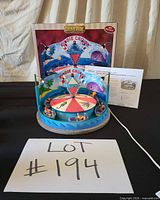 Front view of Lemax Kiddie Cruise Ride with box, power cord and paperwork visible