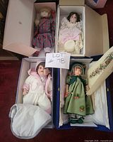Four boxed dolls in original packaging