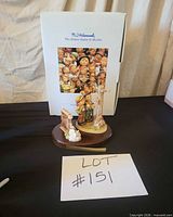 Full set with three figurines on wooden base and original box