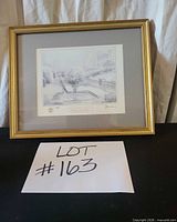 Framed Kinkade print with lot number card visible