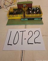 Full view of stock yard accessory with barn, fences, cows, trailer and wiring