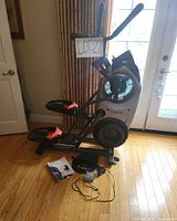 Full view of Bowflex MAX Trainer M5 with pedals, console, and handlebars