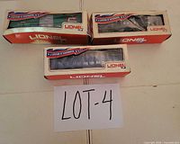 Three boxed Lionel O gauge freight cars