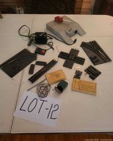 Full lot overview displaying transformer, switches, crossing, track pieces, envelopes and small parts