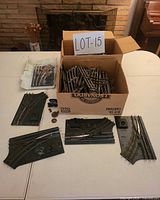 Overall lot with box of rails, turnout switches, controllers