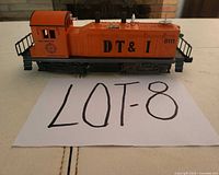 Profile view of Lionel DT&I 8111 switcher on white surface