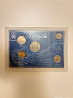 Front of Bermuda coin set showing five coins and blue display card