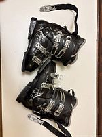 Top view of both black Dalbello ski boots showing buckles and straps