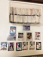 Tub filled with rows of hockey cards plus some sleeved cards displayed