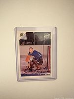 Front of encased Johnny Bower signed card