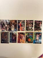 Front view of all ten basketball trading cards laid out flat, showing player imagery and designs