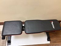 Bench in flat position showing full length and branding