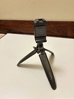 Tripod opened in standing position showing phone clamp and ball head