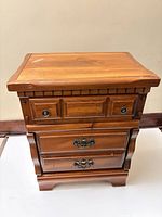 Front view showing three drawers, hardware, overall design