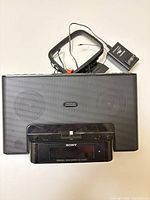 Front view of Sony clock radio with dock and accessories