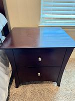 Front view of nightstand showing two drawers and knobs
