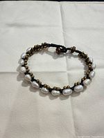 Full bracelet view, pearls and spacer beads visible