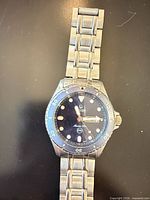 Front view showing dial, bezel, and bracelet