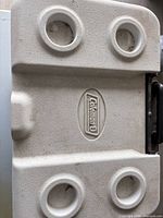 White lid with four cup holders and Coleman logo