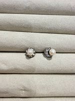 Front view of both stud earrings showing pearls and crystal halos