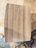 Top view of grey wood-grain laminate surface