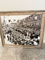 Front view of framed vintage parade print showing full image and frame