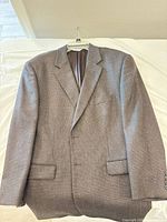 Front view of brown/taupe lambswool blazer on hanger