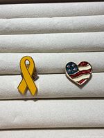 Overview of both lapel pins on display surface