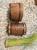 Wooden bucket, embossed planter and faux grass shown from side