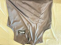 Gray softshell vest with logo patch and zip chest pocket