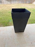 Full view of tall matte black square planter