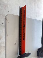 EdgeSweep orange blade cover and cutting blade section