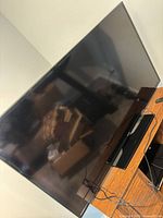 Front view of Samsung flat-screen TV on stand