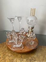 All seven candle holders grouped on wooden turntable