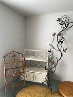 Entire lot showing bamboo rack, white shelf unit, metal wine rack