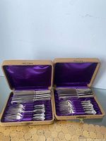 Both presentation boxes open showing full contents