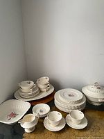 Group shot of entire Spode Billingsley Rose set including plates, bowls, cups, saucers, platter and covered dish