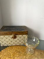 Trunk and glass compote side by side