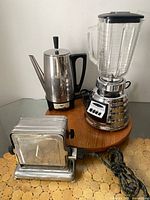Group view of blender, percolator, toaster showing overall lot