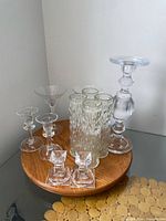 Group shot of all glass items on wooden turntable